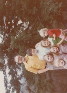 My Daddy. Tall like the trees behind him. I am the girl standing closest to him.